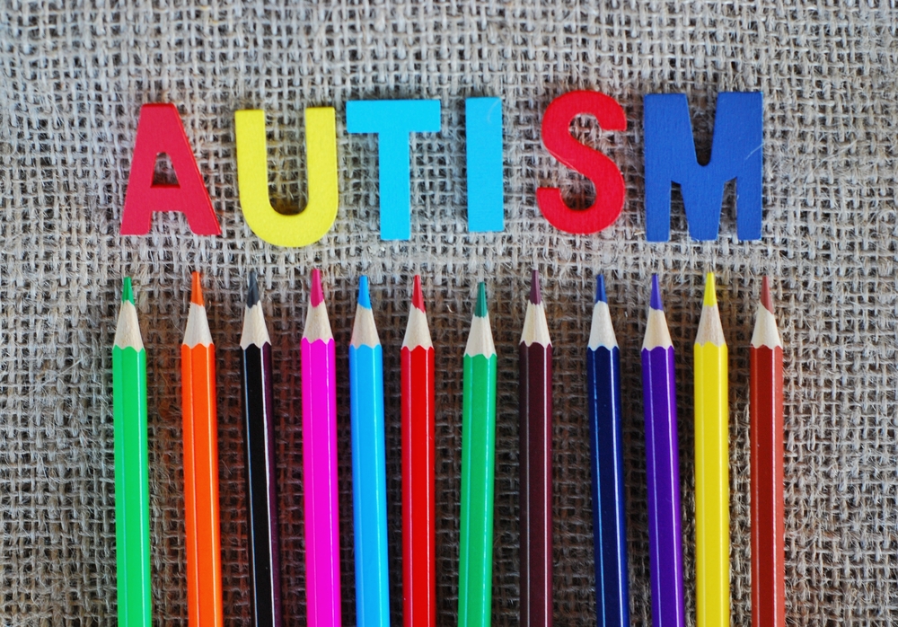 Colored pencils and letters spell out "Autism" in speech therapy Los Angeles program